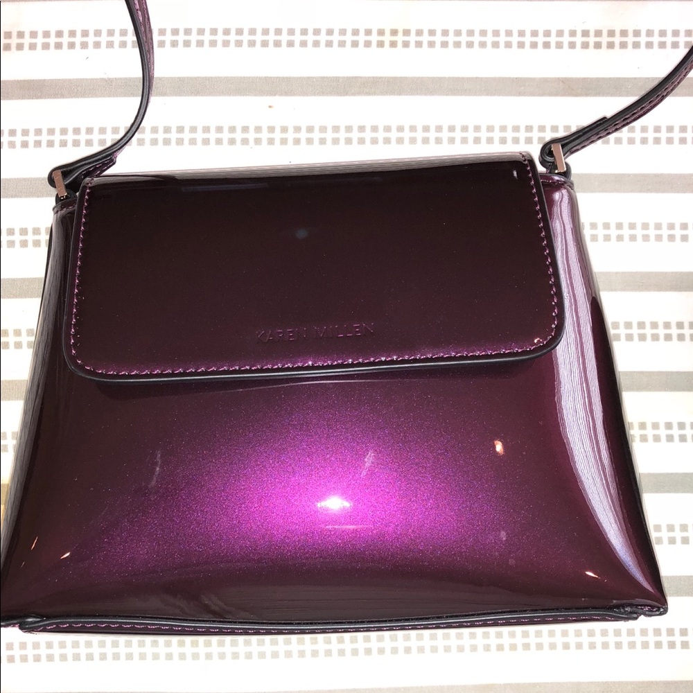 Dark purple patent crossbody bag.